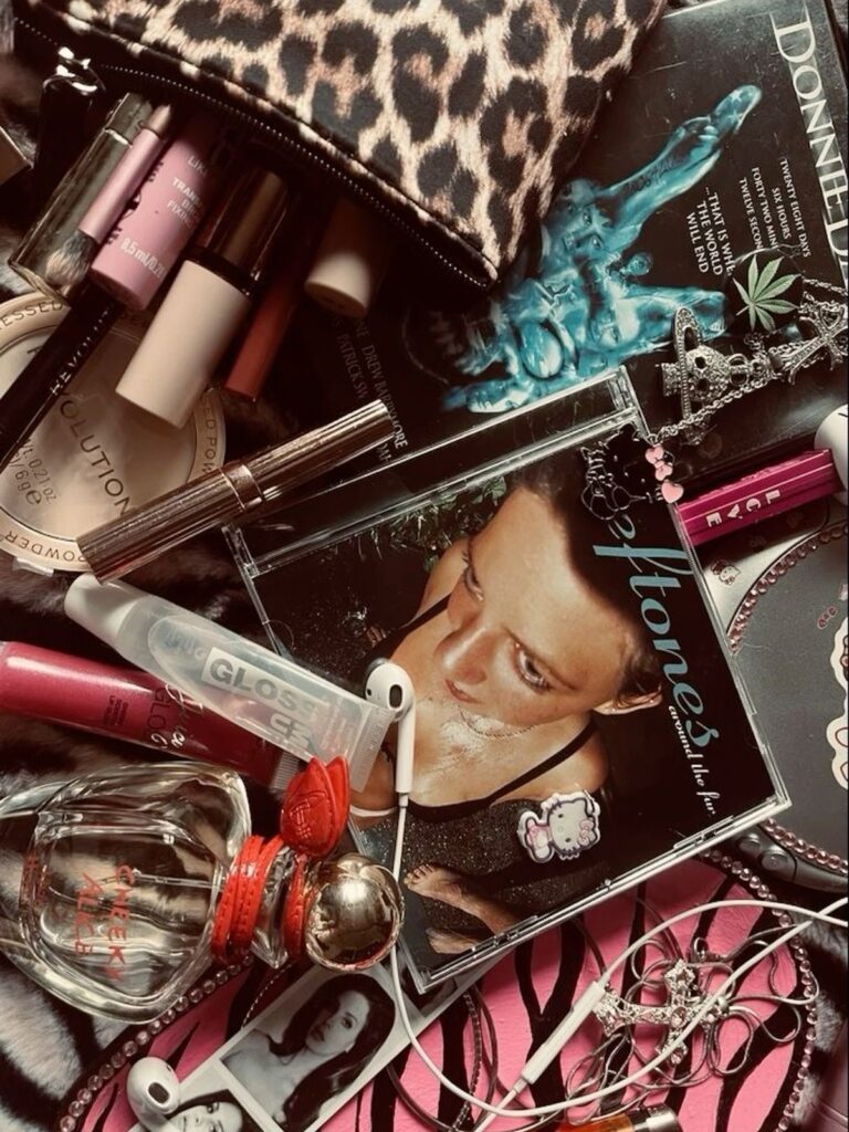 A pile of makeup and jewlery 